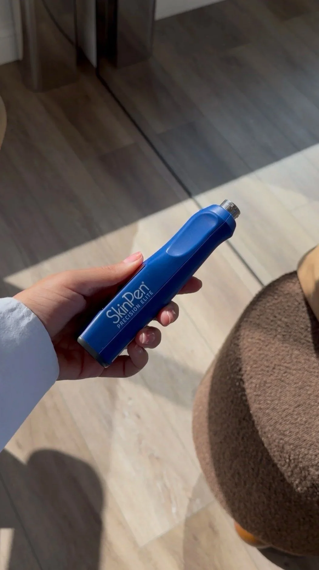 Nurse holding a skinpen microneedling device