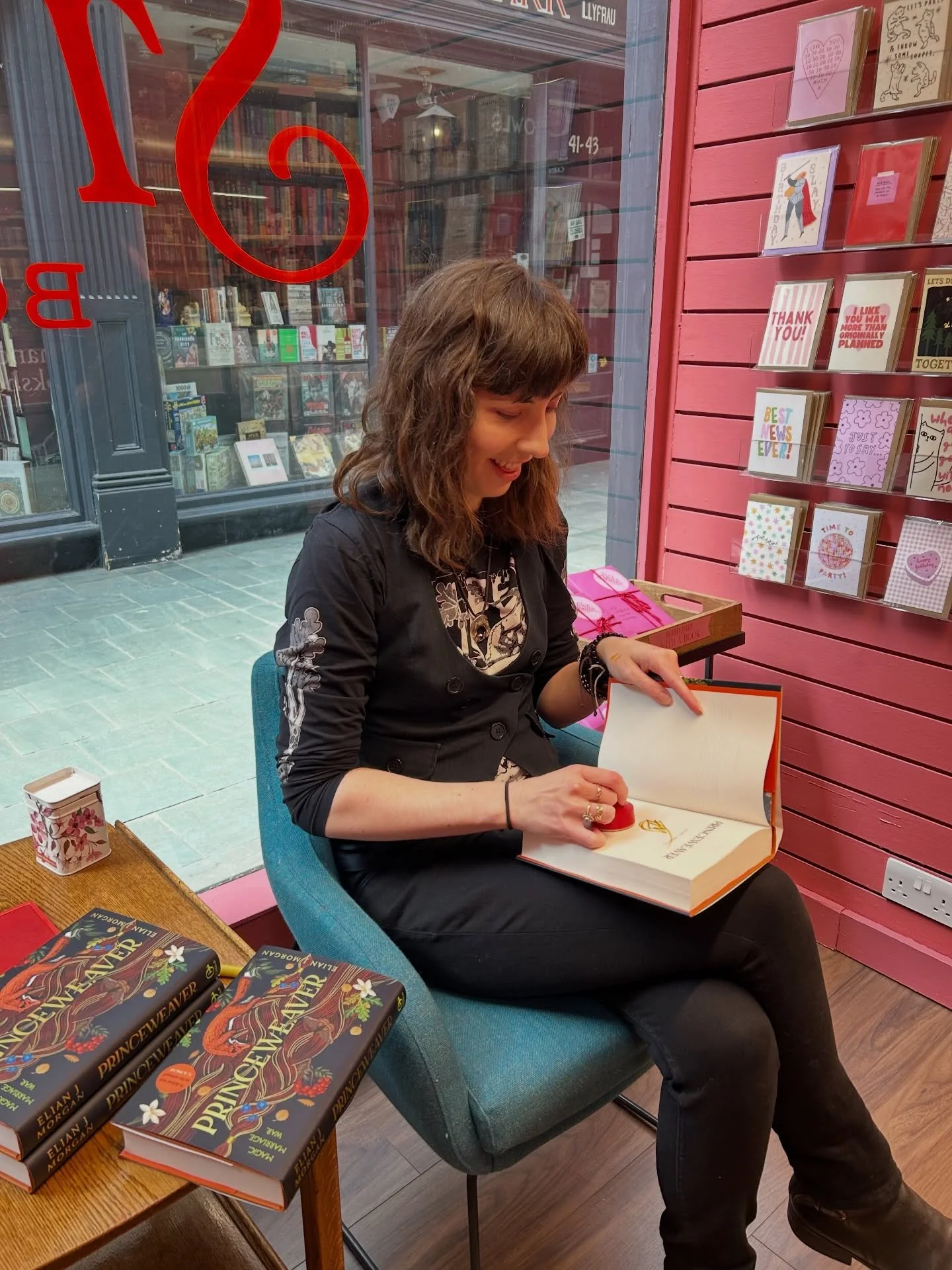 The wonderful @elianjmorgan came in today to sign and dedicate copies of their epic fantasy Princeweaver (inspired by Welsh folklore!!!) 👑🌱 We&rsquo;re so excited for this release 🥰