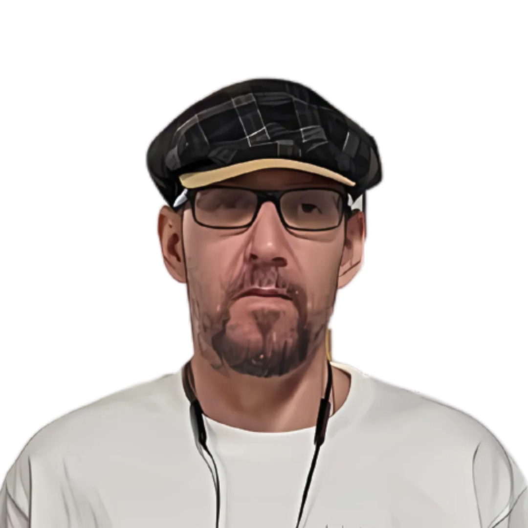 A man wearing a black checkered cap, glasses, and a white shirt with earbuds around his neck.