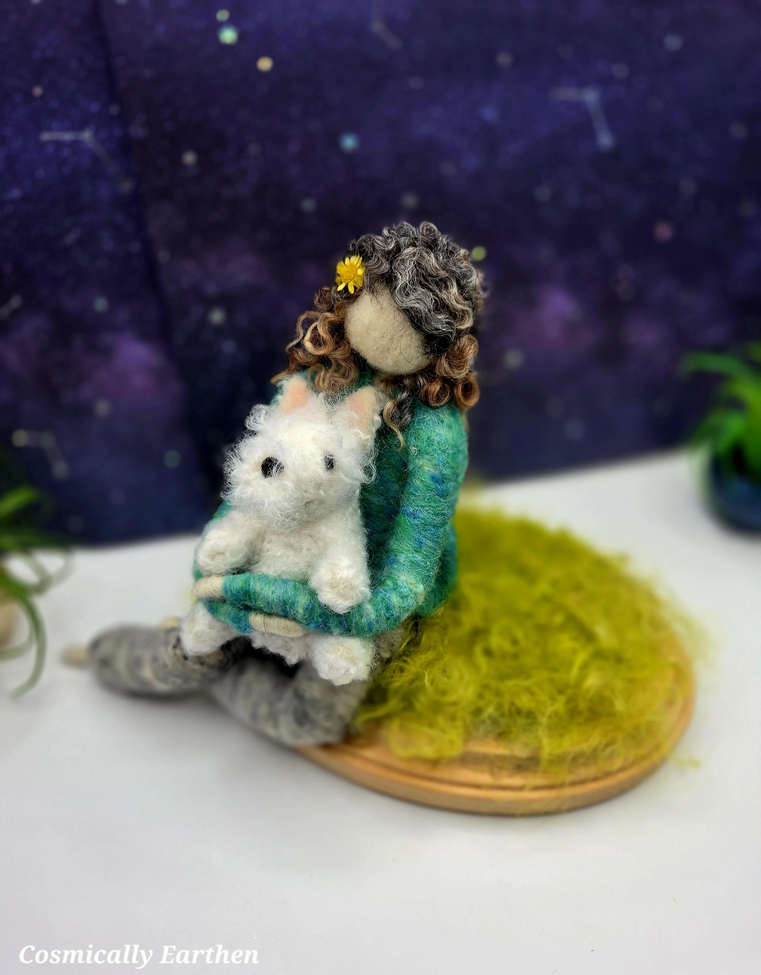 Custom needle felted Westie dog companion keepsake with handmade woman figure seated on mossy base beneath starry sky by Cosmically Earthen.