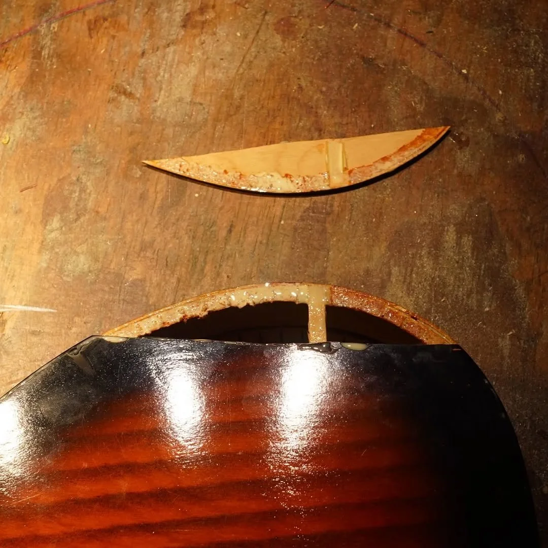 Before and after on a rather distressed mandolin that came in to the shop. The gaping hole was an interesting look but I think it's better without it!