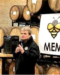 Congressman Mike Quigley talking on microphone to Bowmanville community members at Half Acre Brewing Company.
