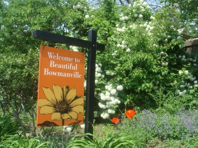 Orange Welcome to Beautiful Bowmanville sign on Bowmanville Avenue.