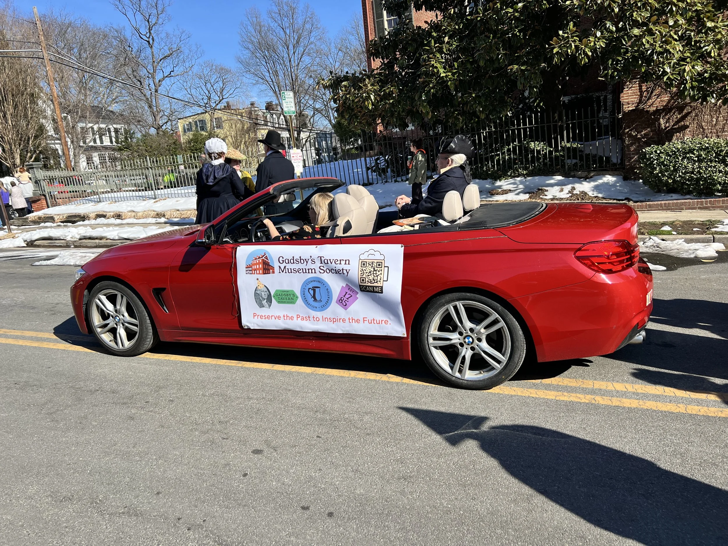 John Gadsby's re-enactor rides in red convertible for Alexandria's GW Parade.