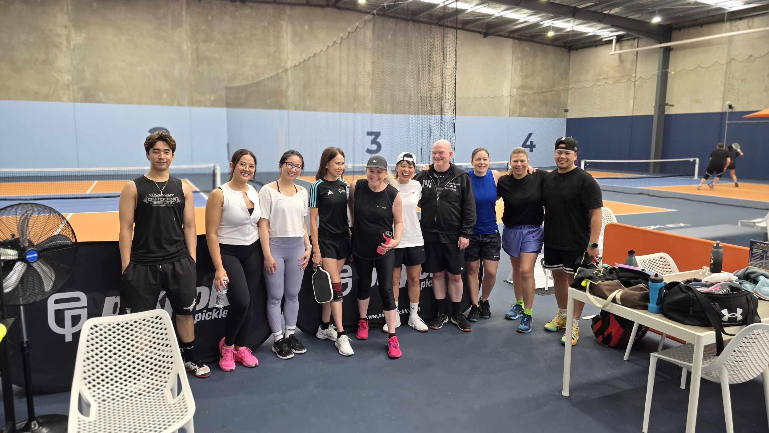 GROUP PLAYING PICKLEBALL