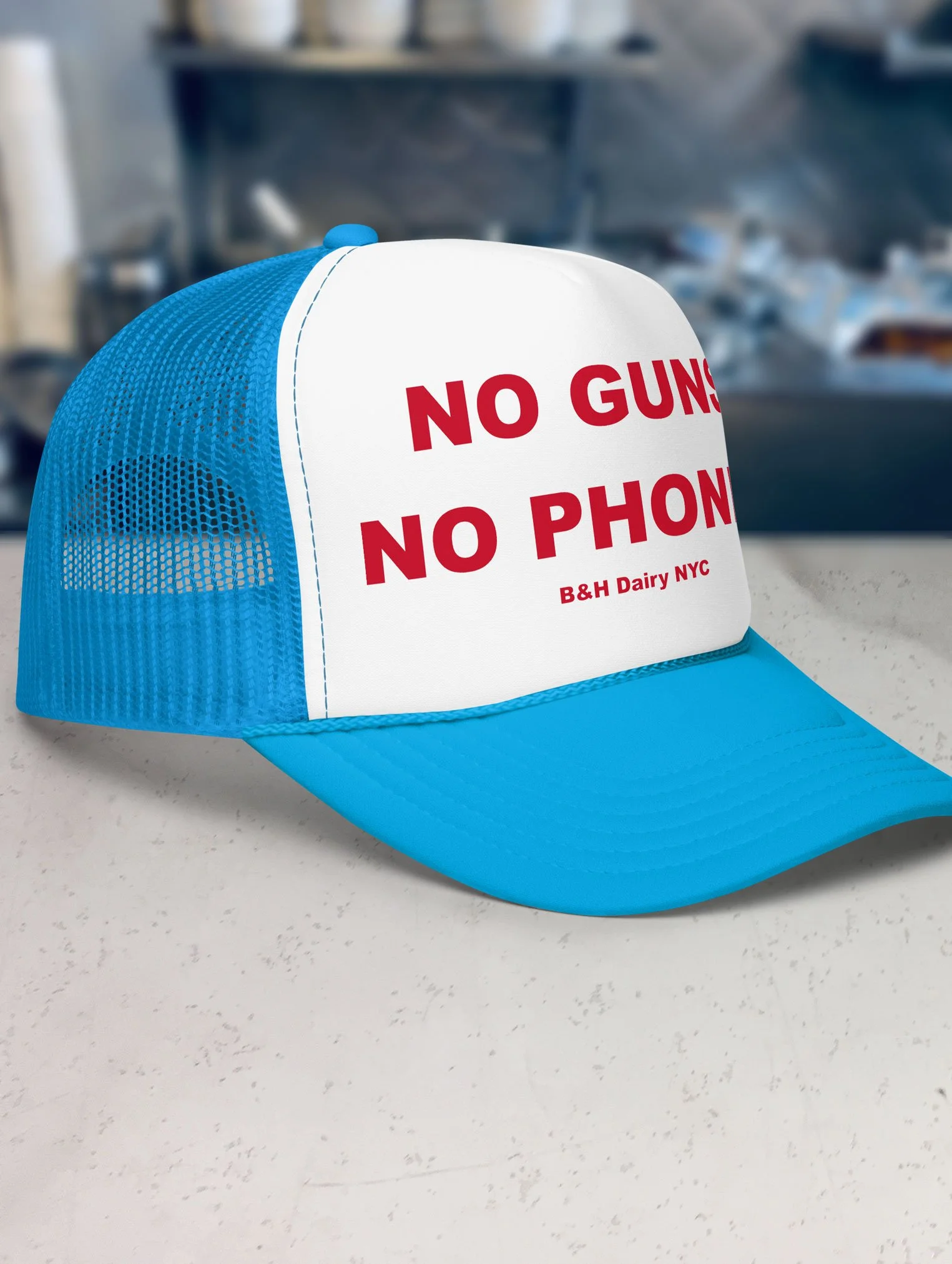 b-and-h-dairy_no-guns-no-phones_trucker-hat_blue-and-white_side.jpg