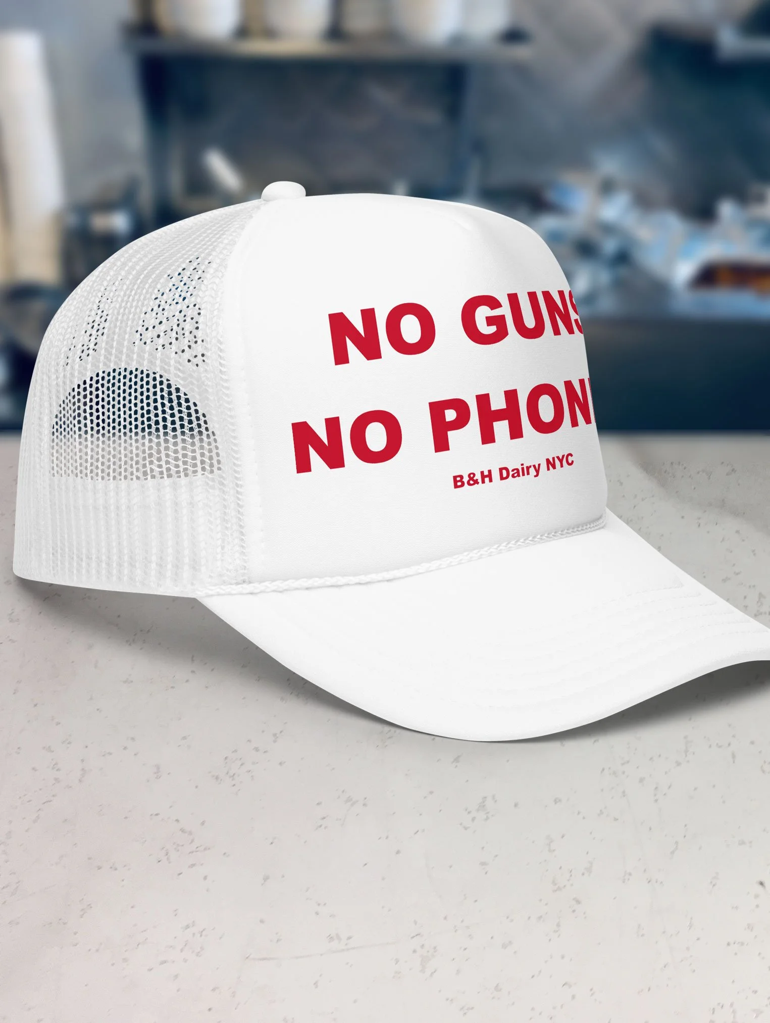 b-and-h-dairy_no-guns-no-phones_trucker-hat_white_side.jpg
