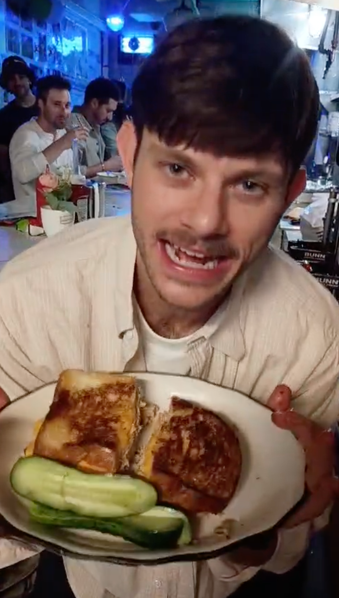 Alex makes a tuna melt at his birthday party