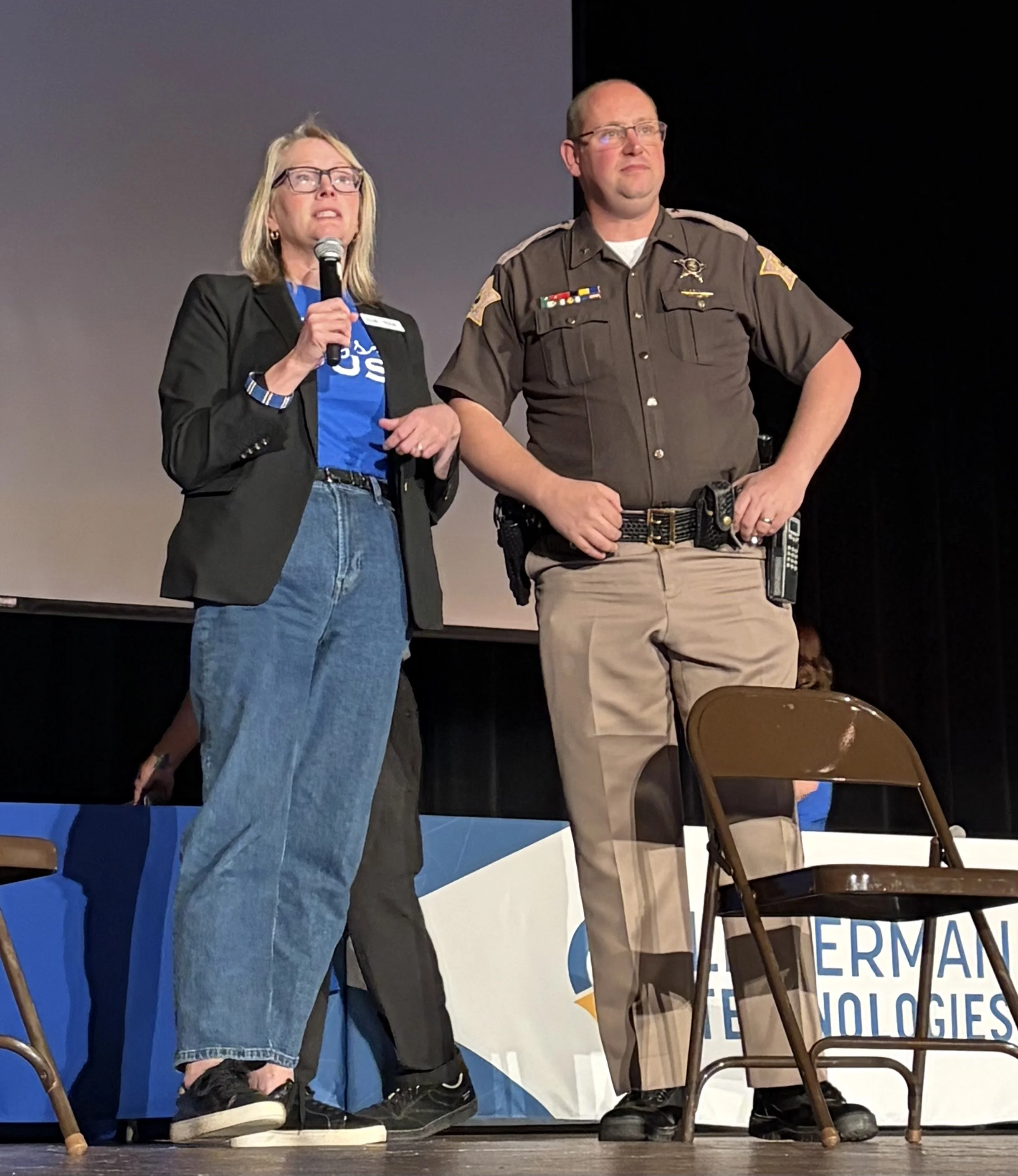 Executive Director Kristine Cordts and Sheriff Noah Robinson at the Digital Safety Summit at Central High School, 2026.