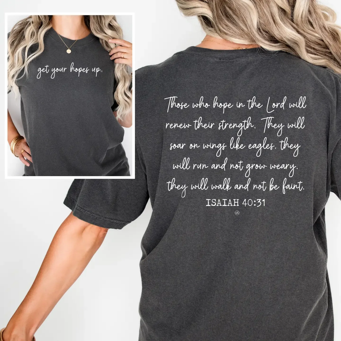 A dark gray t-shirt worn by a woman, with a front and back view in the image. The shirt features white text on both sides. The front says, 'get your hopes up.' The back displays a Bible verse from Isaiah 40:31, which reads, 'Those who hope in the Lord will renew their strength. They will soar on wings like eagles. They will run and not grow weary. They will walk and not be faint.' The woman has blonde hair styled in waves, is accessorized with gold jewelry, and is wearing a black skirt or shorts.