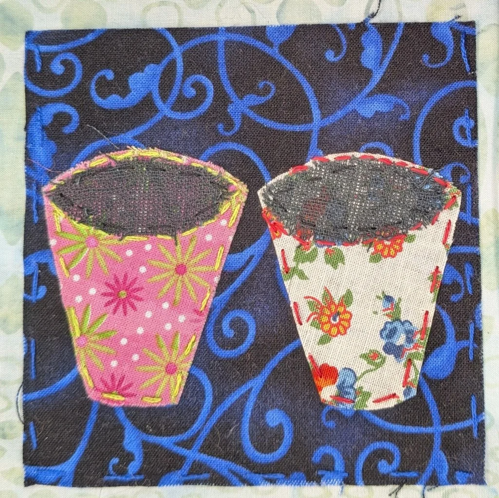 two pretty, flowered buckets