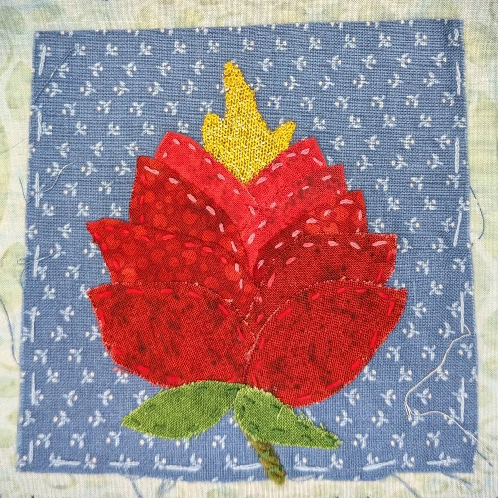 red rose with gold flame emerging