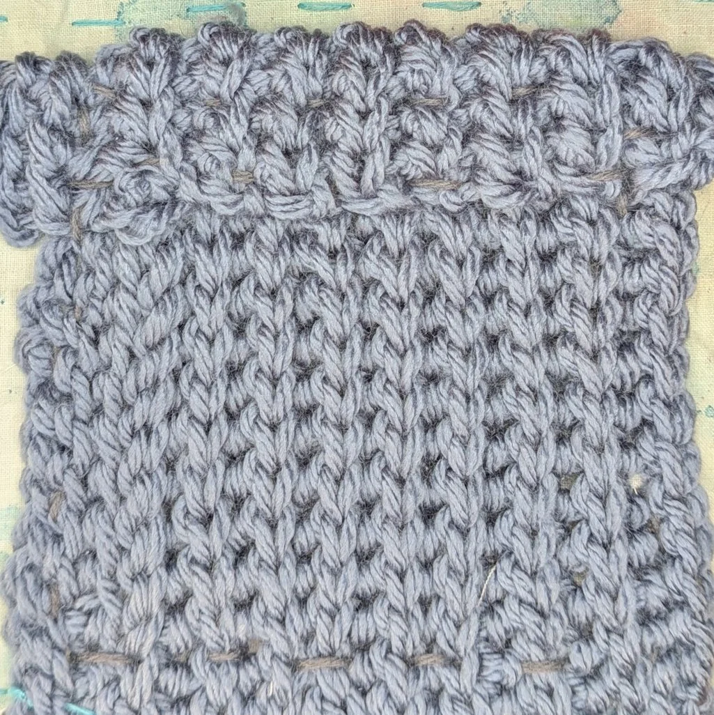 Tiny blue crocheted blanket