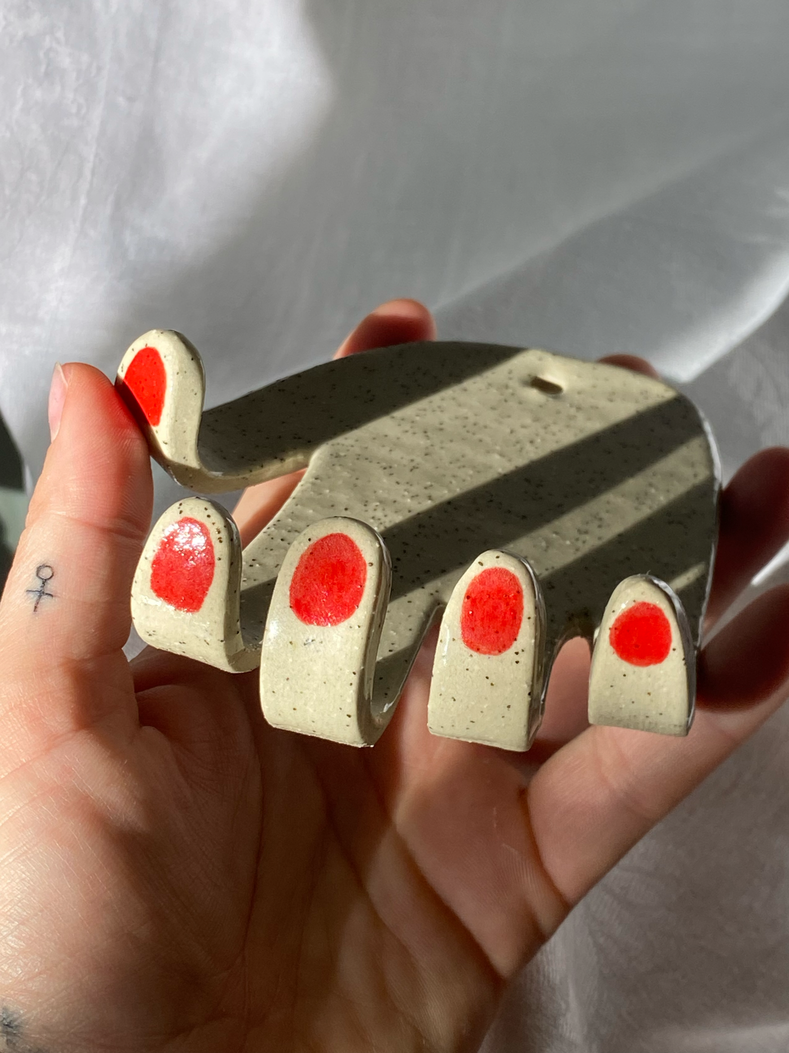 Untitled, 2025. 
Stoneware clay, underglaze, clear glaze.