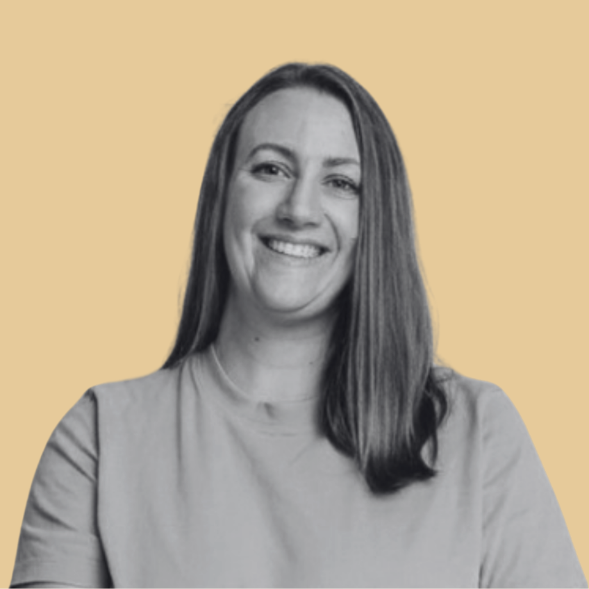 smiling woman with straight hair on yellow background