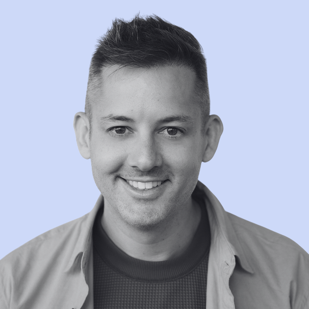 black and white photo of smiling man with dark hair