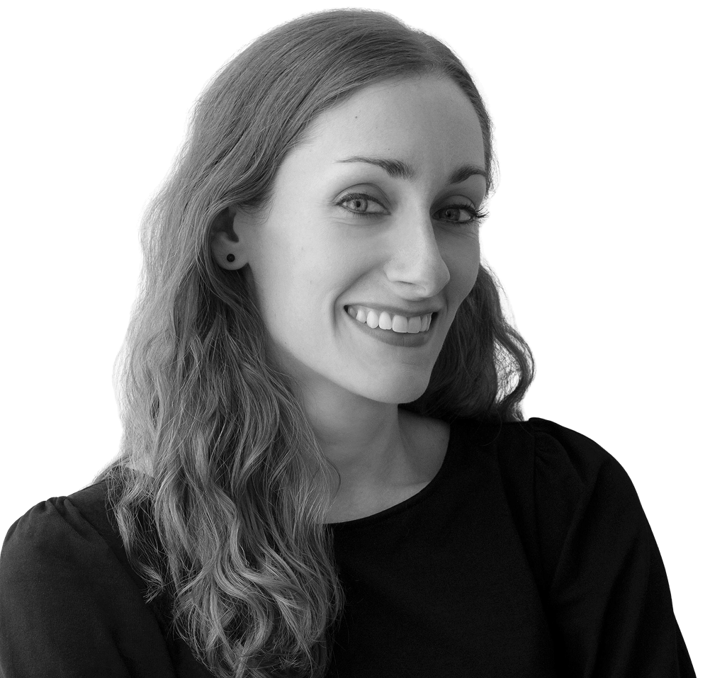 smiling woman with wavy hair wearing a black tshirt