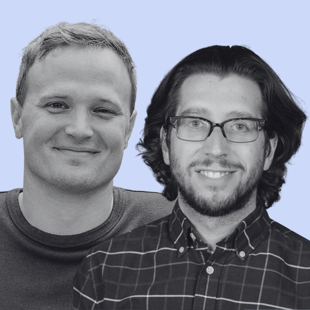 black and white photo of two men both smiling