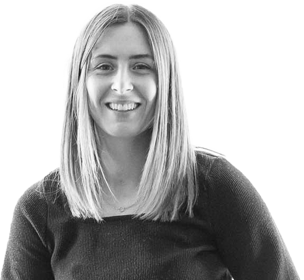 Black and white portrait of a woman with straight hair, smiling