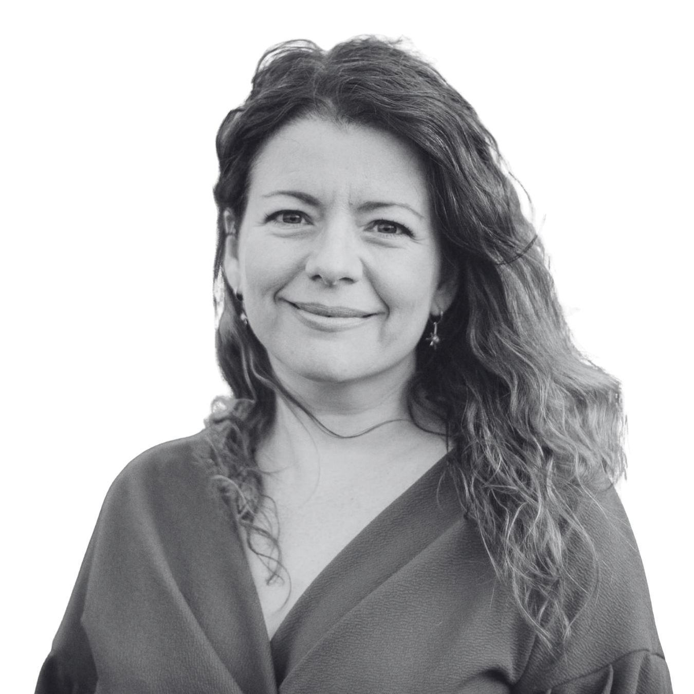 woman smiling with wavy hair and earrings