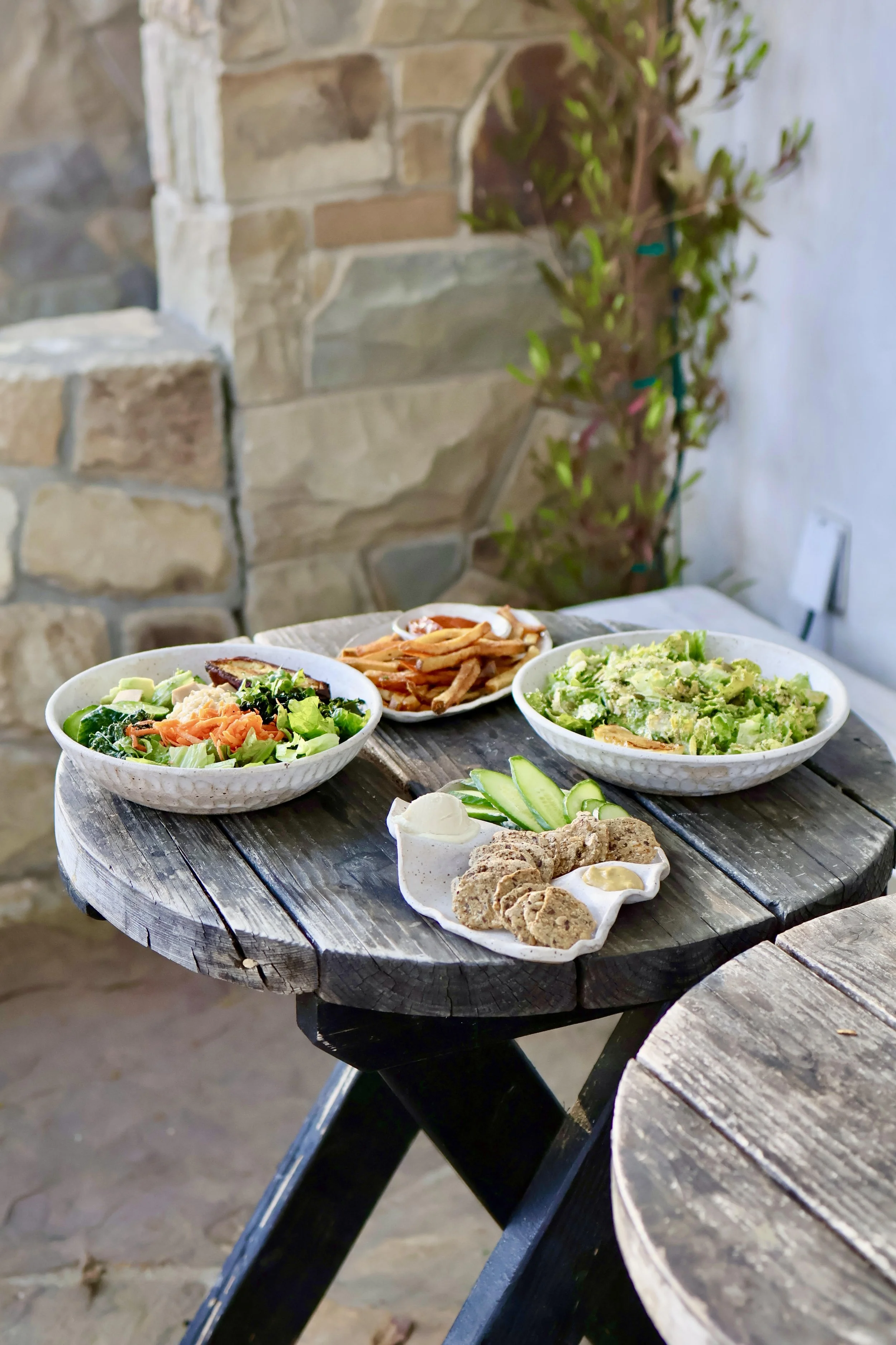 a stack of sculptural wave plates 3 on top of one another on a white surface