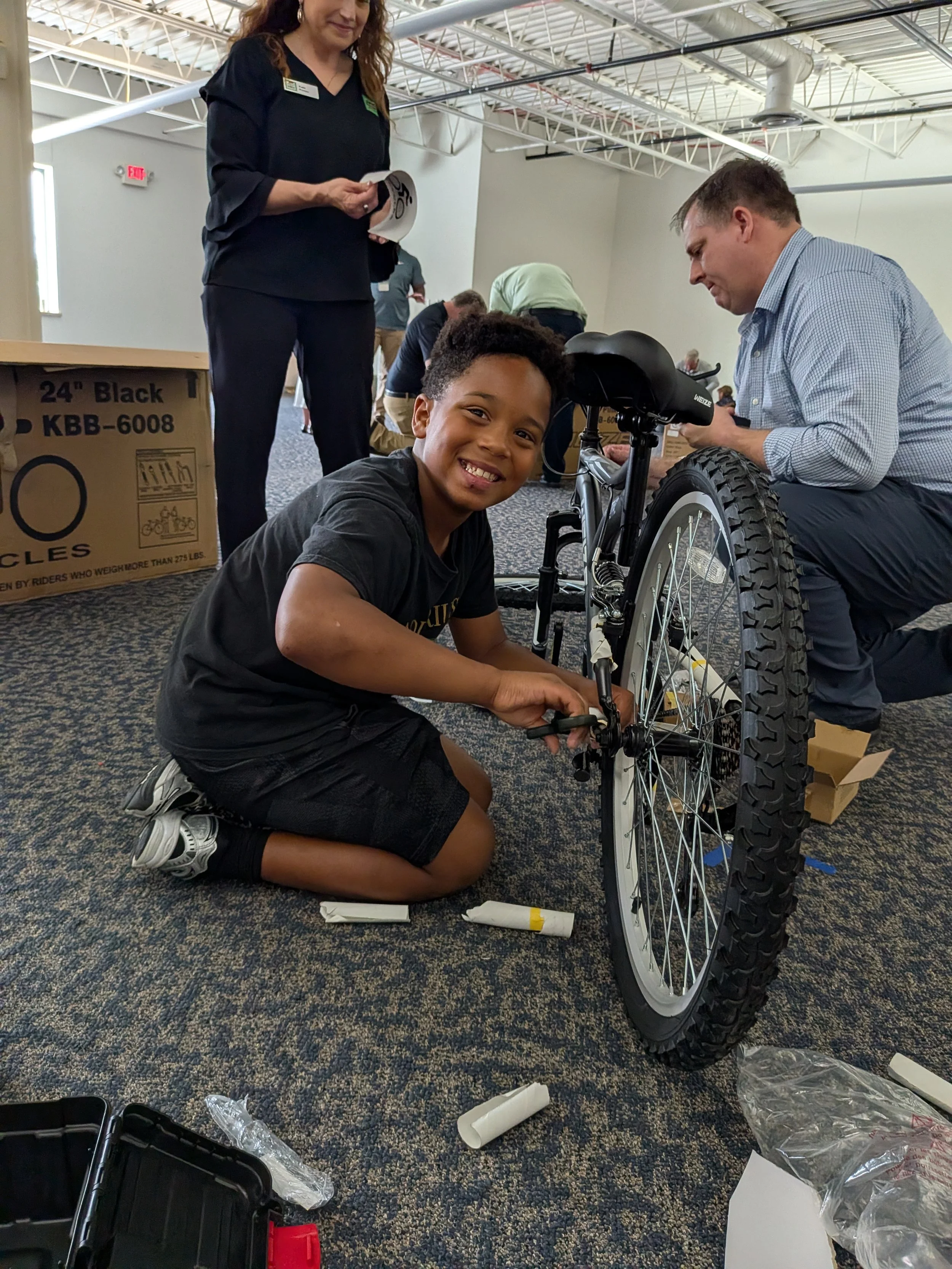 Jones Dairy Farm Team hosts Build a Bike Event to support BASE Bike Program