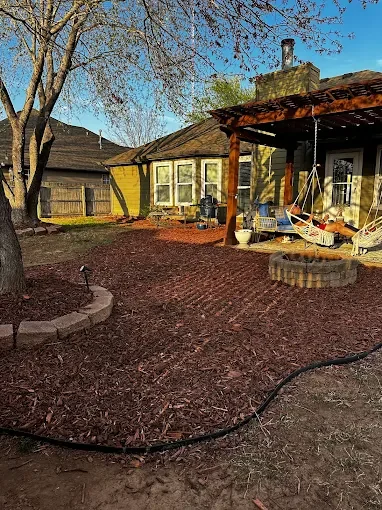 Tulsa landscaped backyard with mulch