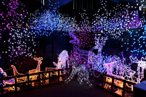 Large-scale commercial Christmas lighting installation with LED displays and illuminated holiday decor