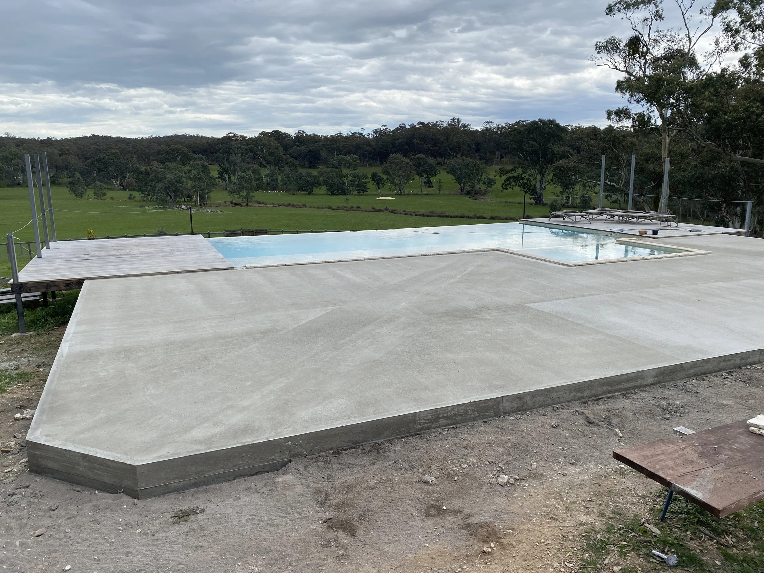 Suspended concrete paving slab for swimming pool patio in Yandoit