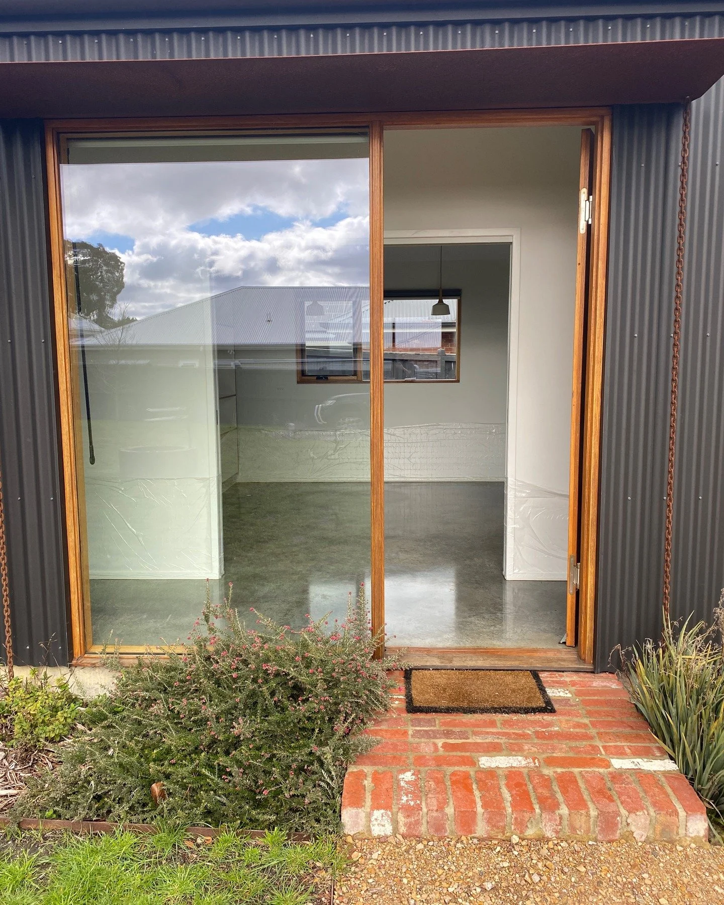 Back at a @house.workshop build of mine from 5 years ago to renew the @livosaustralia Kunos natural oil finish on our burnished concrete slab. The colour variation and depth that comes through with the Livos product really elevates and brings the con