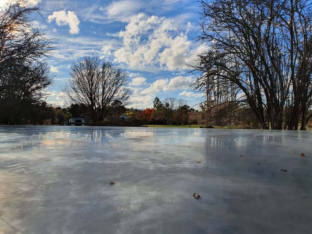 winter sky reflections in burnished concrete shed slab