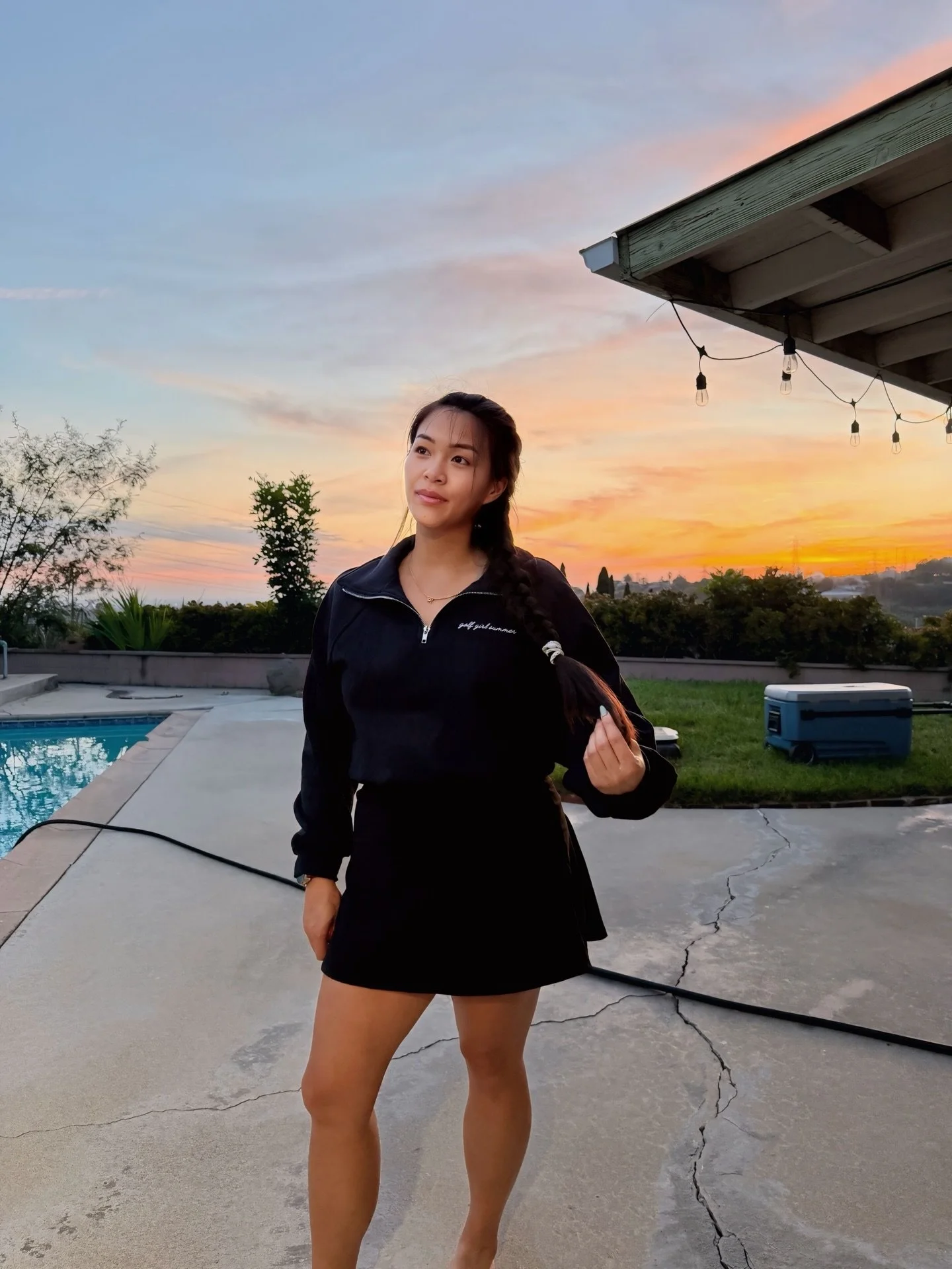 Girl wearing 3/4 embroidered Golf Girl Summer sweater