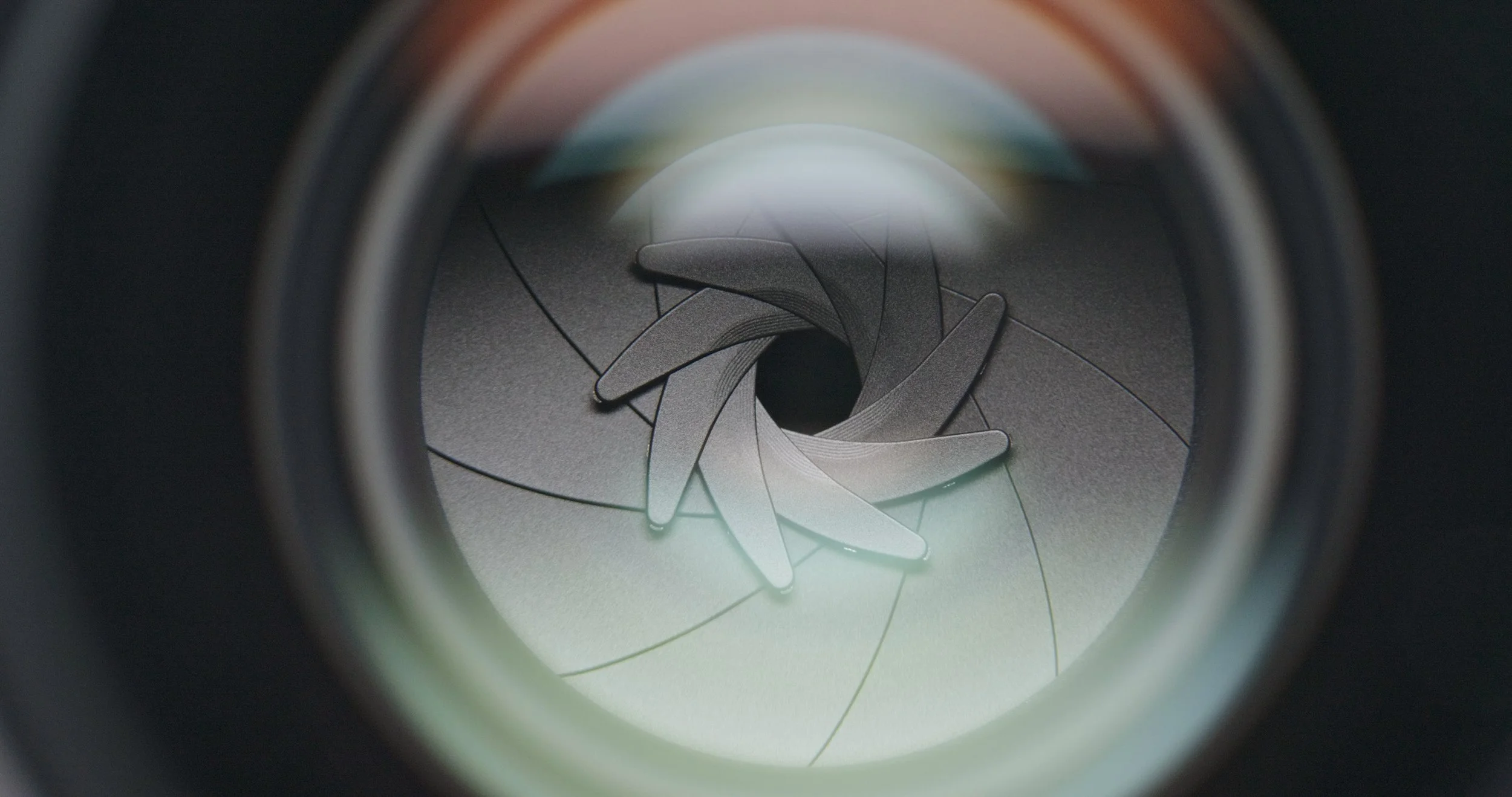 Close-up view of a camera lens aperture blades.
