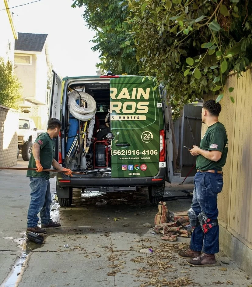 Drain Bros Plumbing and Rooter Inc. team photo with van
