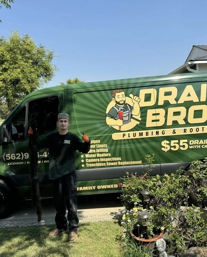 Drain Bros Plumbing and Rooter Inc. team photo with van