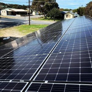 Rooftop solar panels overlooking a suburban neighborhood
