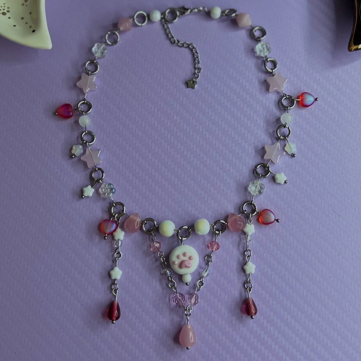 handmade-pastel-pink-paw-necklace.jpg