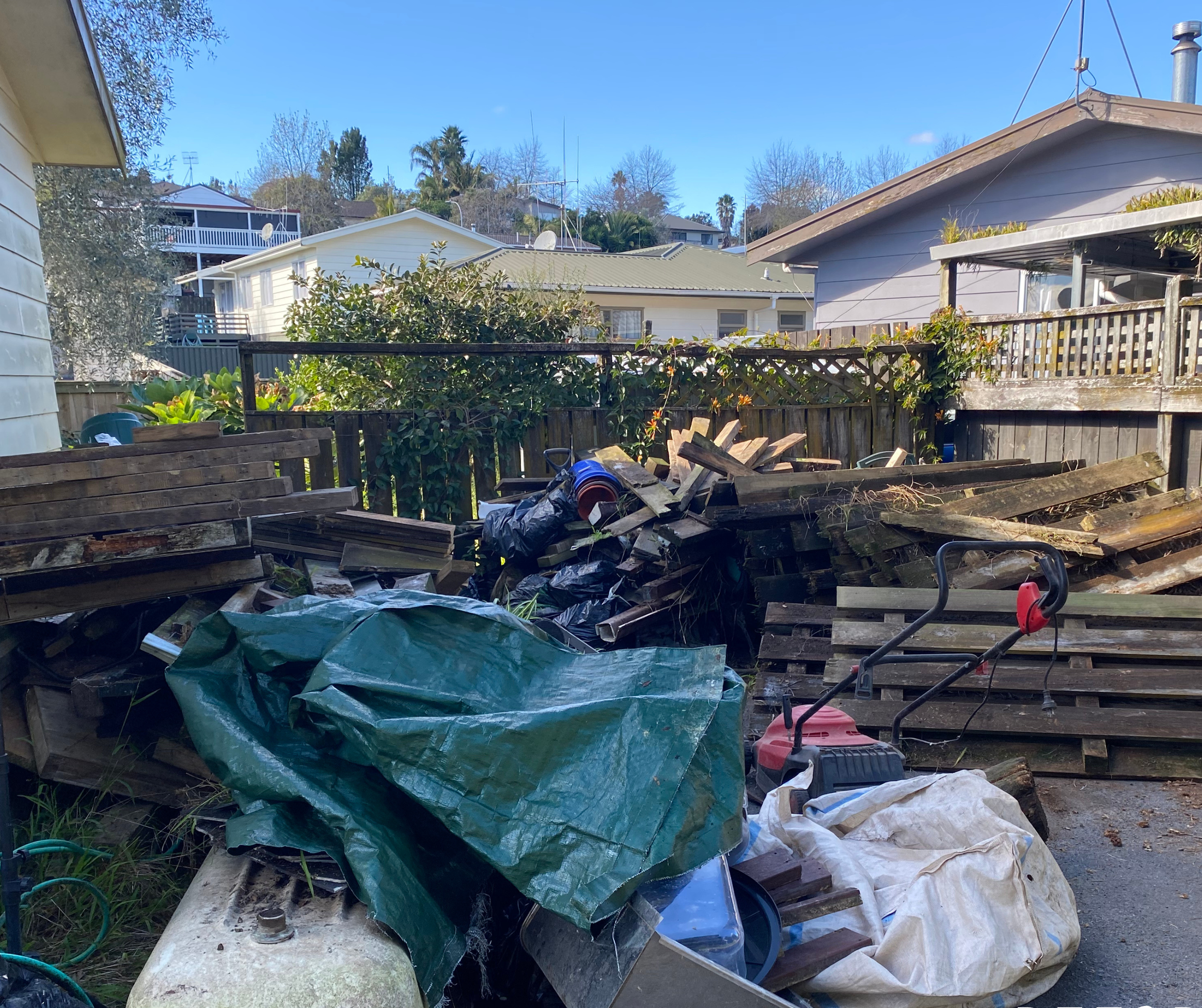 House sale preparation - clearing junk and rubbish underneath and around the property in Welcome Bay, Tauranga