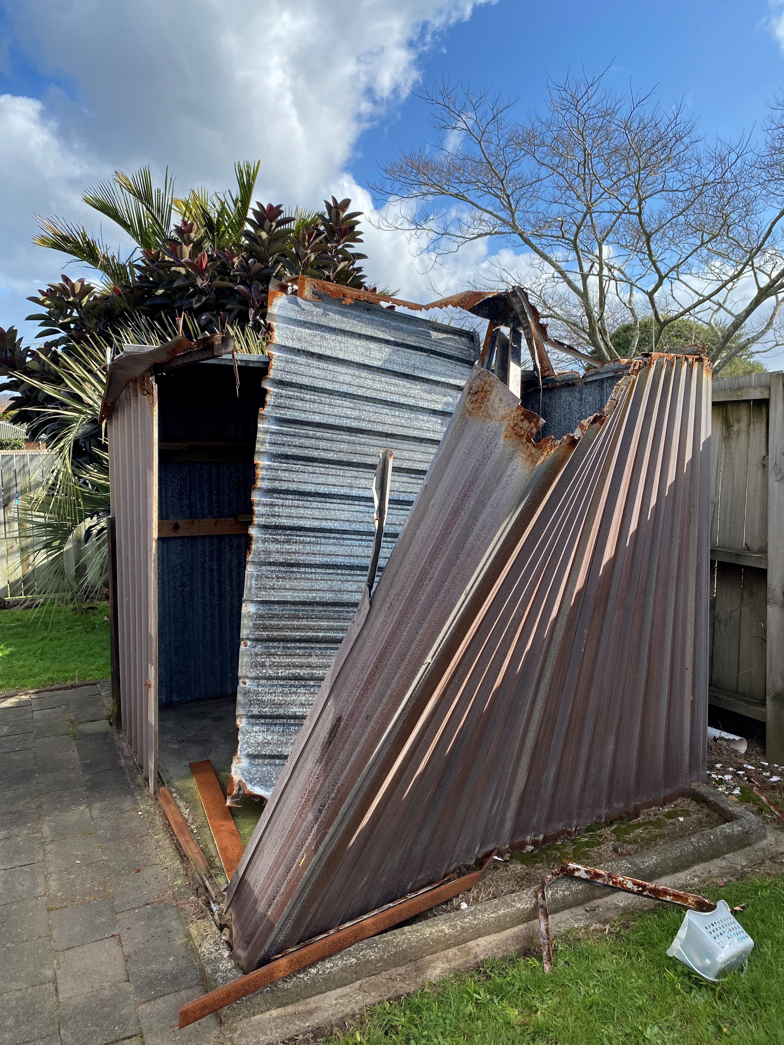 Shed removal - deconstructing a falling down shed due to a storm in Papamoa.