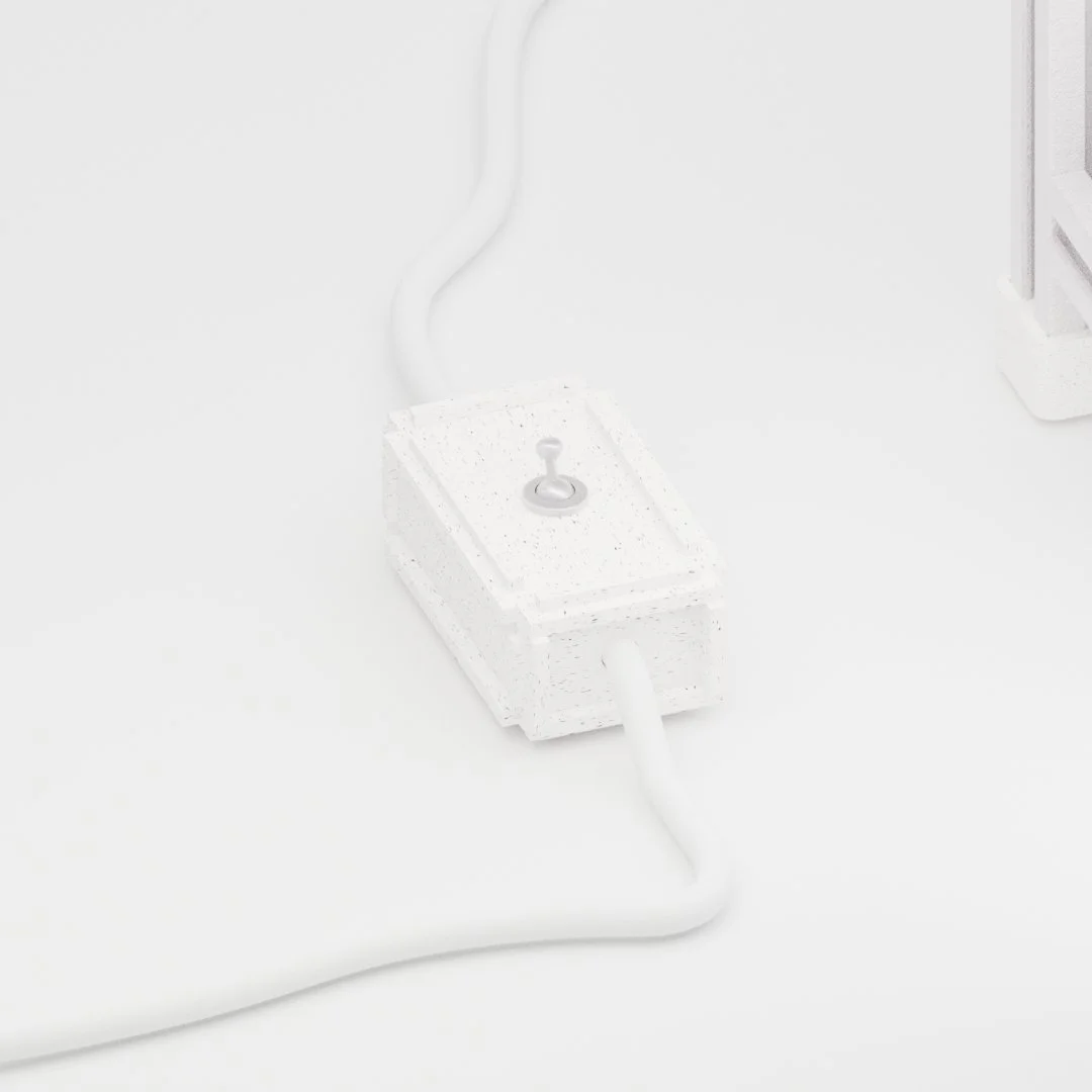 Close-up of a white electrical plug socket with a switch, connected to a white cord, on a white surface.