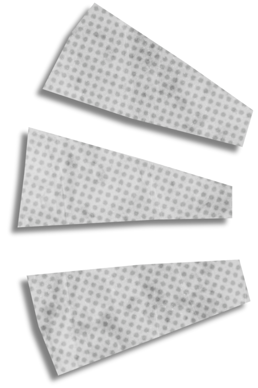 Three white adhesive bandage strips with small gray dots, lying on a black background.