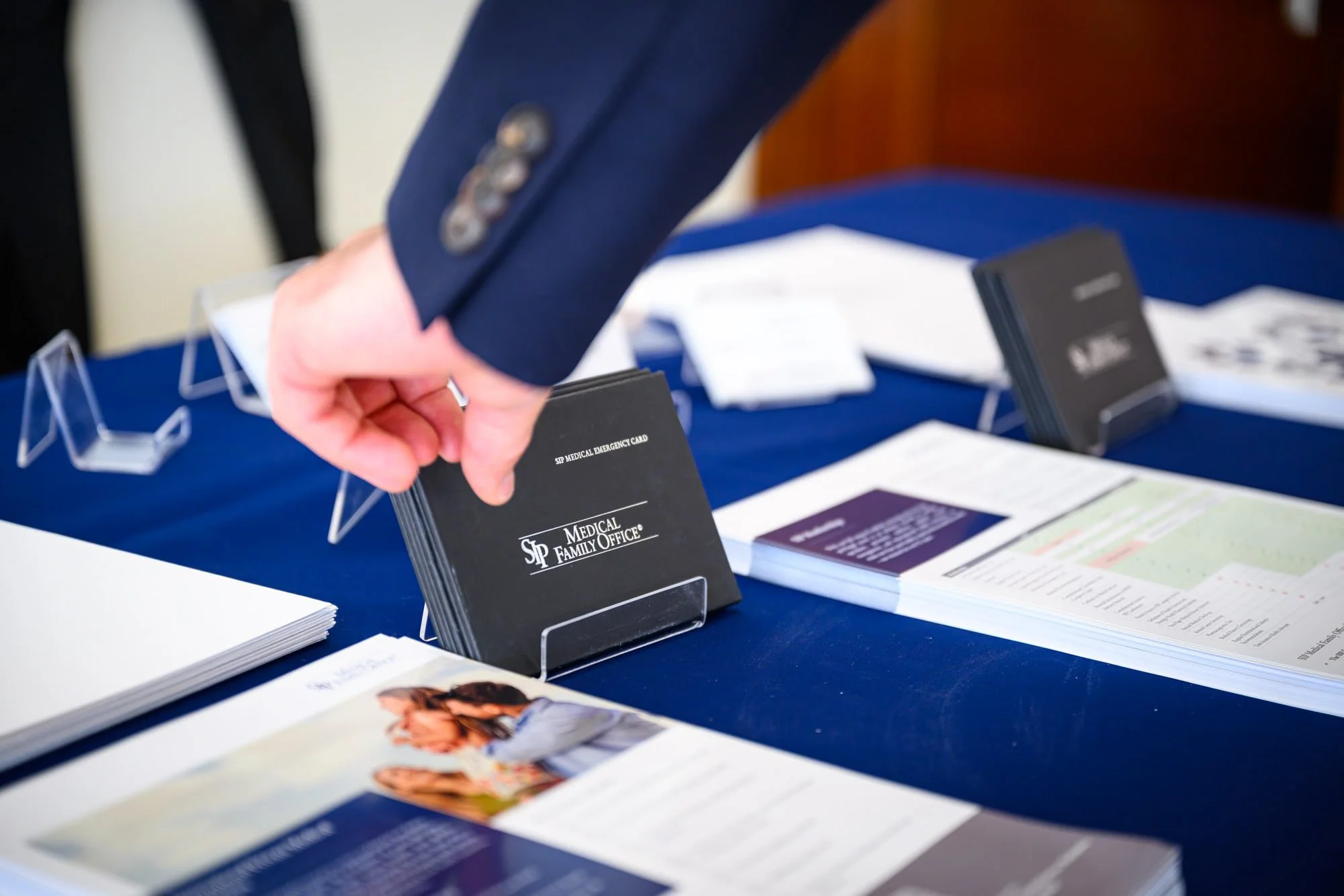 corporate-event-photography-nice-registration-badges-conference-desk-anthony.jpg