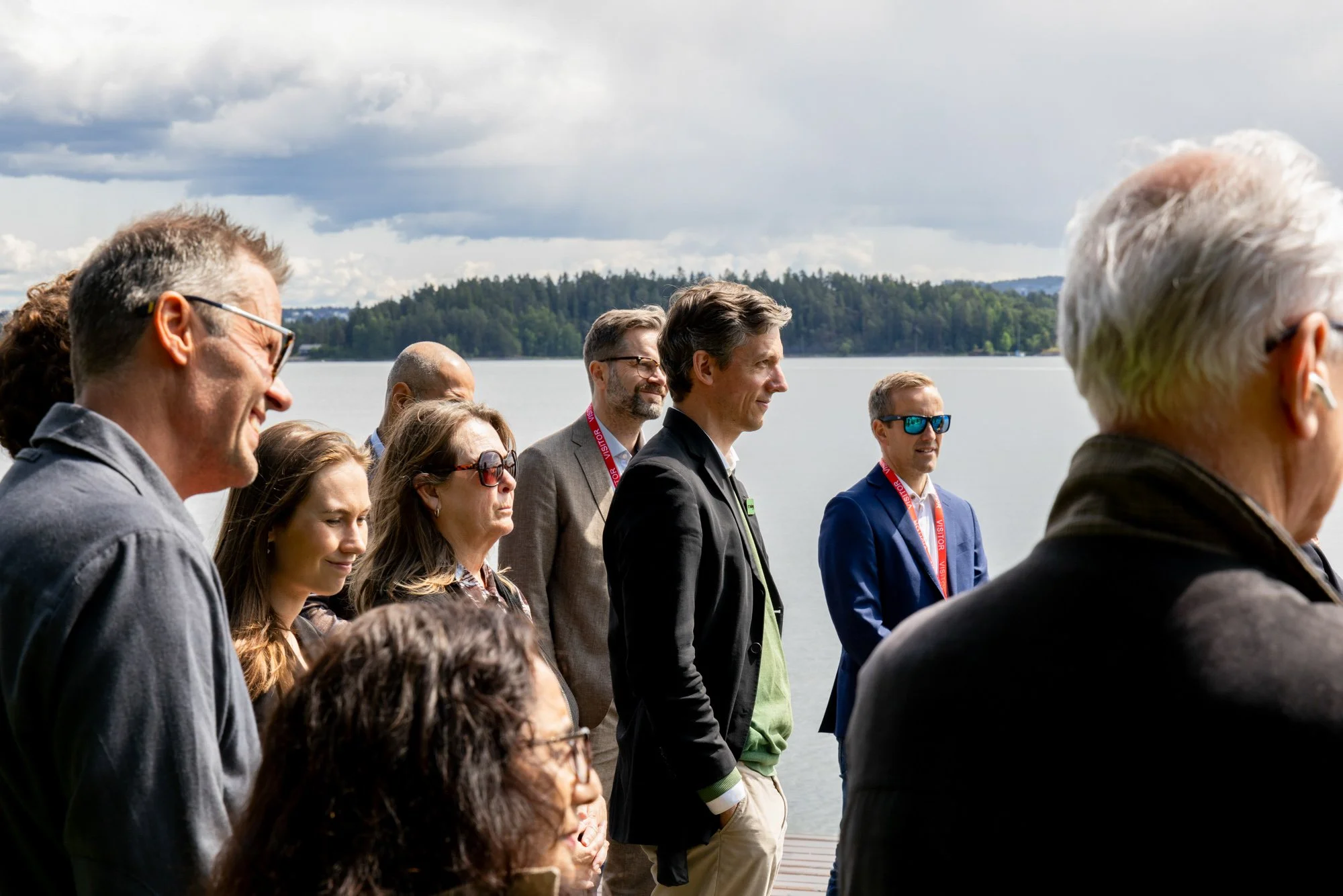 corporate-event-photography-oslo-guests-listening-outdoor-presentation-thea.jpg