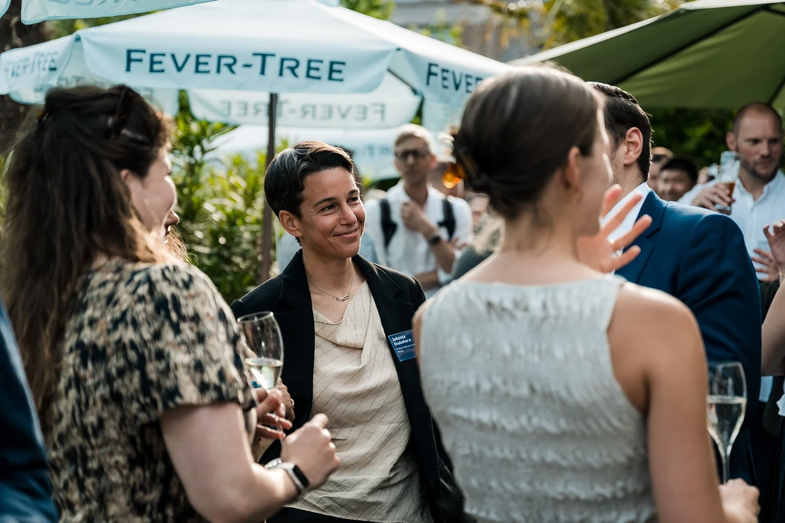  Conference attendees networking outdoors during Money20/20 Europe, captured by a professional event photographer. 
