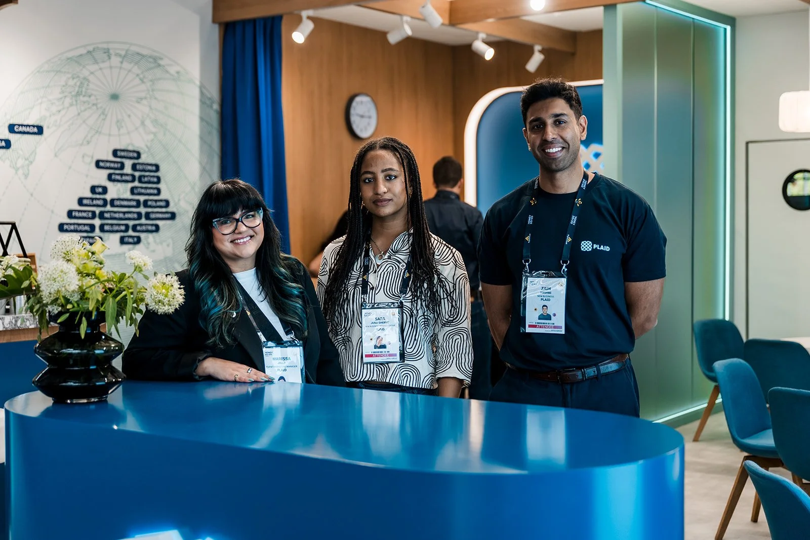  Exhibition team photographed on a conference stand at Money20/20 Europe. 