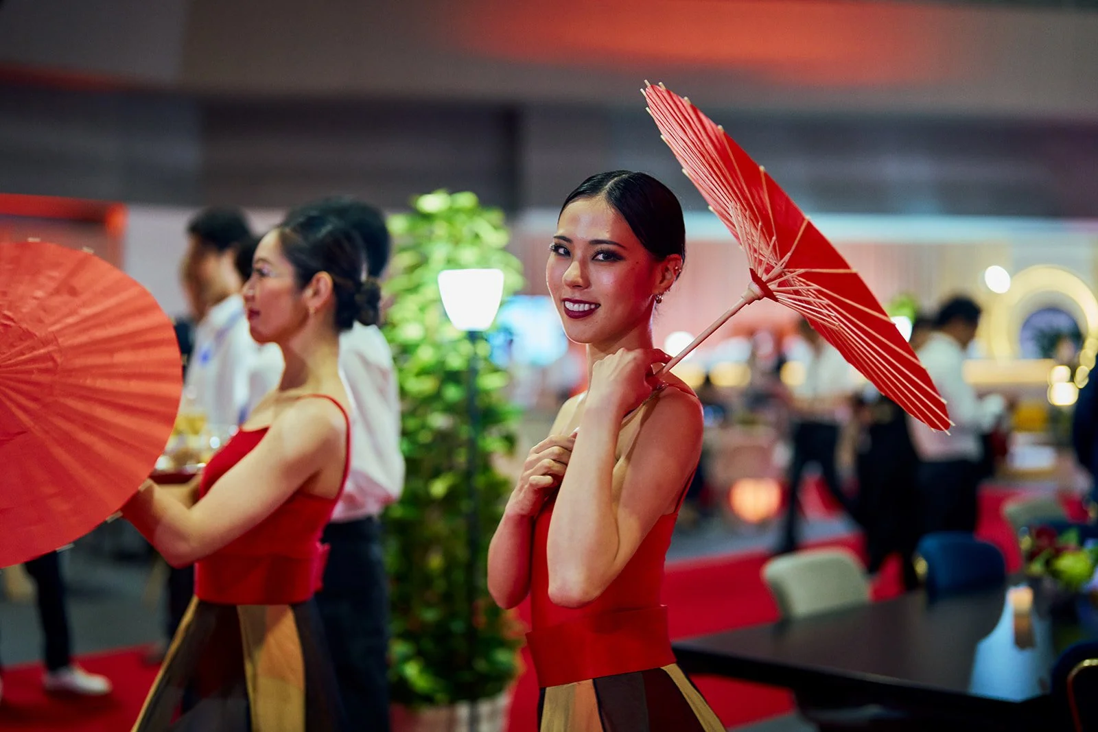 formula-e-tokyo-hospitality-performers-red-parasols.jpg