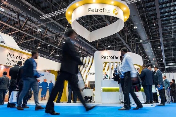 Corporate trade show photography capturing delegate movement around a large exhibition stand.