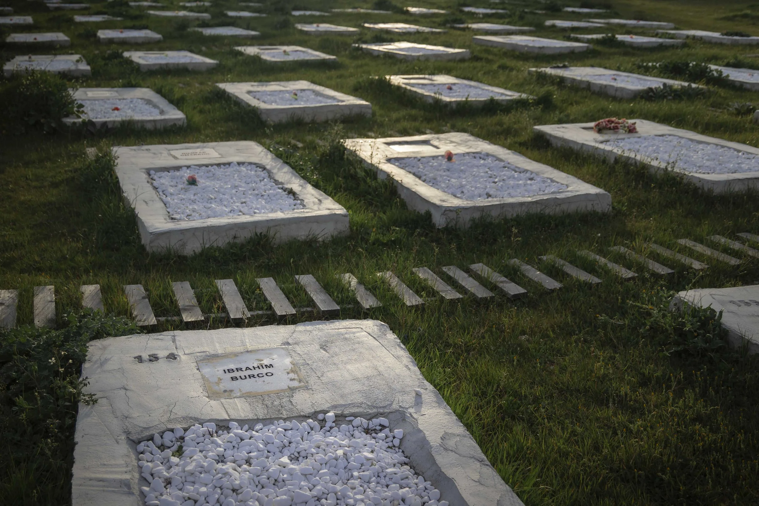 In Kato Tritos, an old cemetery abandoned after the 2020 fire, with lives lost at sea and in the hotspot, was recovered in 2023. The Memorial to Humanity project identified, beneath the rubbish and dense vegetation, 1.189 graves containing people of 