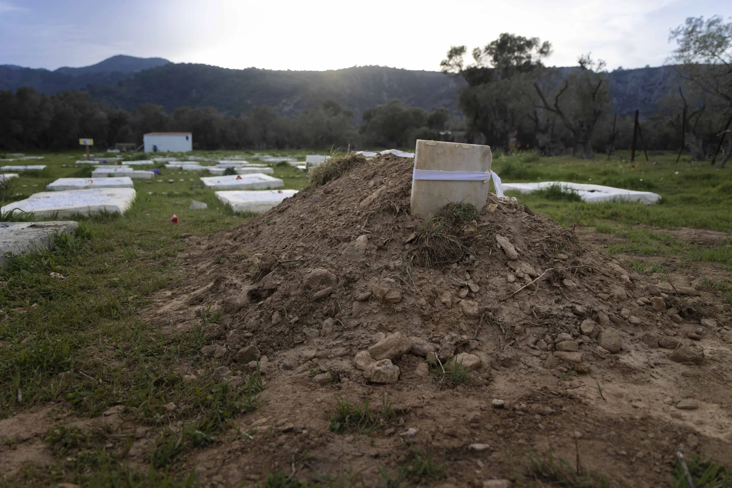 In Kato Tritos, an old cemetery abandoned after the 2020 fire, with lives lost at sea and in the hotspot, was recovered in 2023. The Memorial to Humanity project identified, beneath the rubbish and dense vegetation, 1.189 graves containing people of 