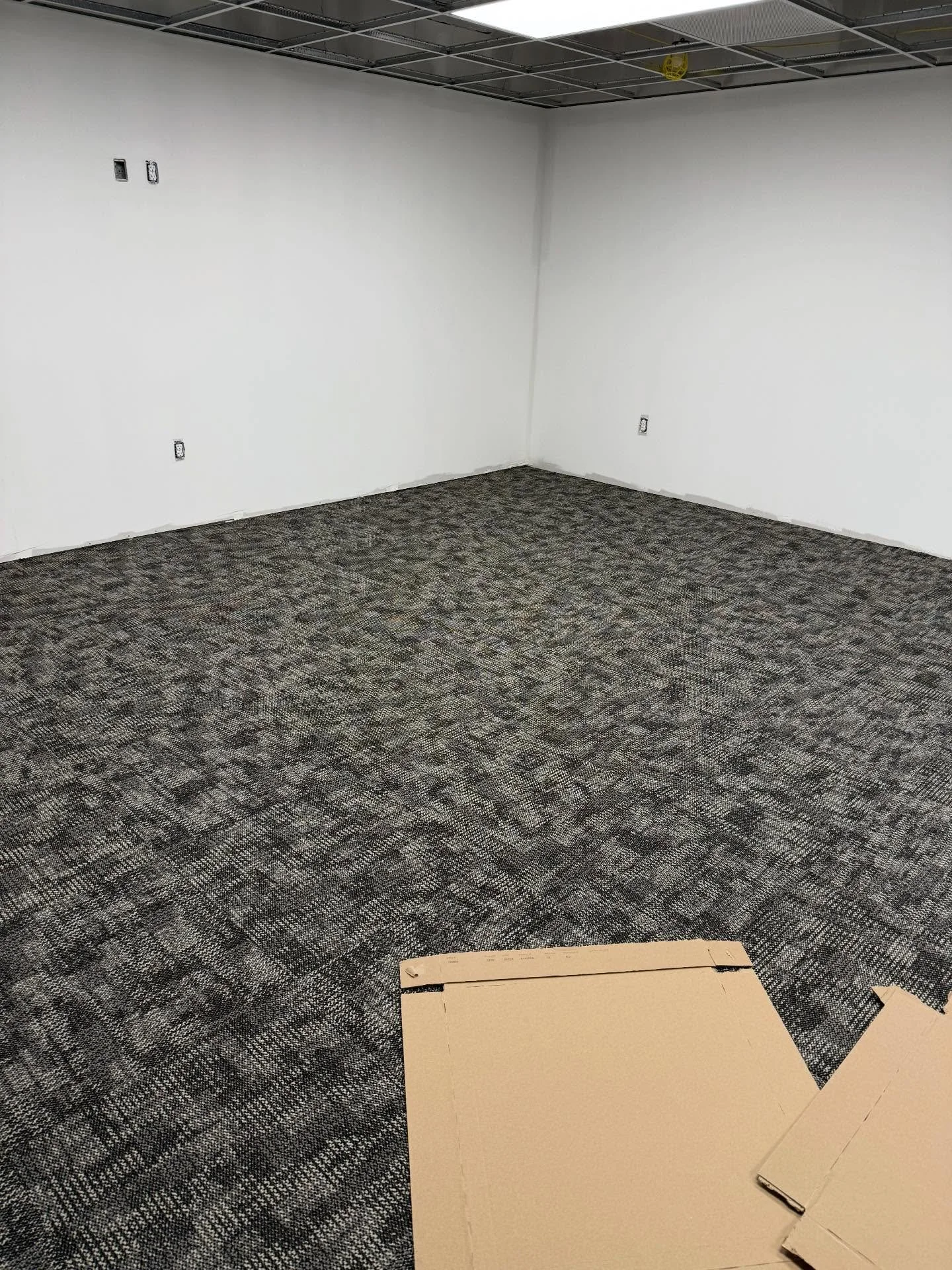 Carpet tiles are going in the new office! So many great things to come!